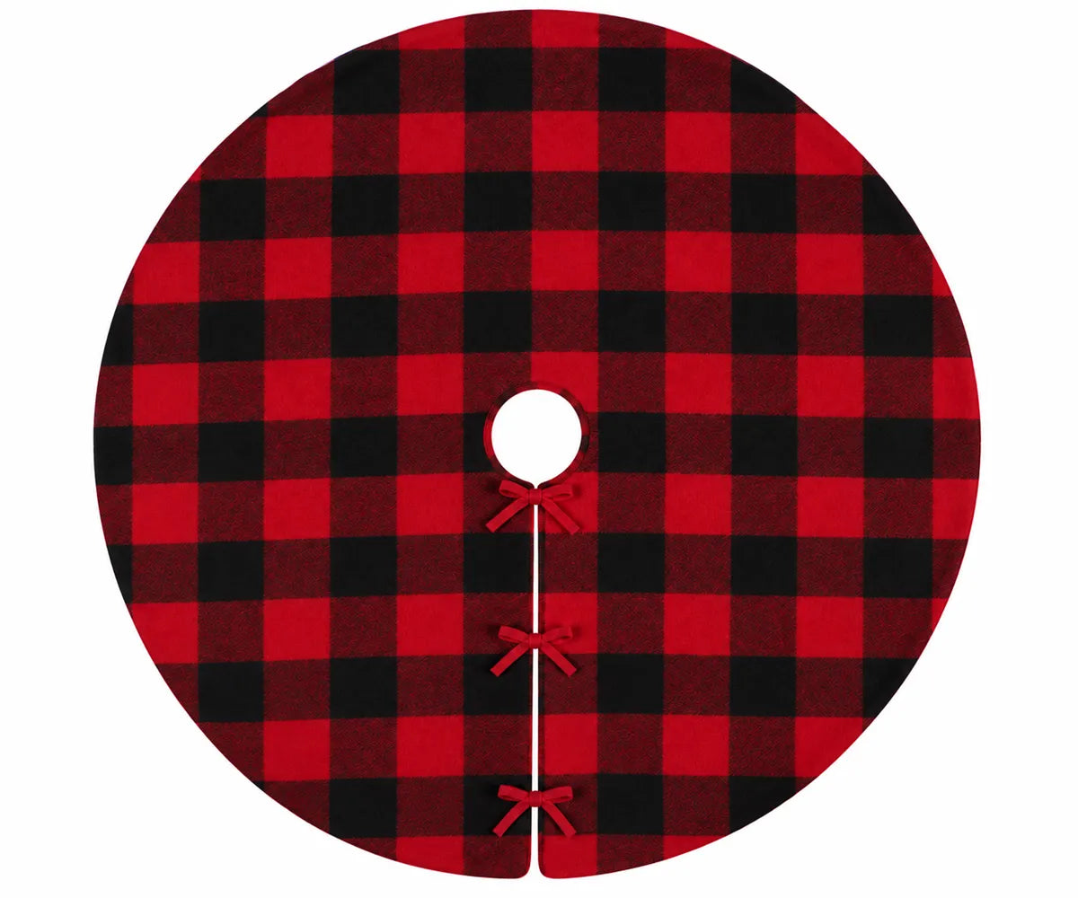 A circular Christmas tree skirt with a classic red and black buffalo plaid pattern, featuring a central hole and three decorative red ribbon bows tied along the bottom edge, shown on a plain white background.
