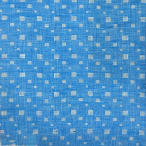 Blue cotton fabric with small white geometric pattern