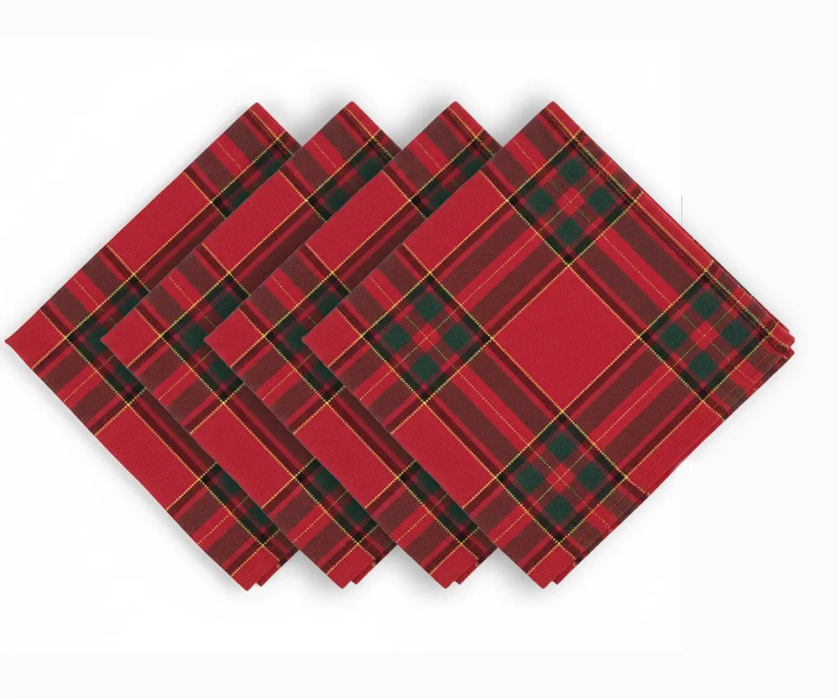 Set of red, black, and yellow tartan plaid cotton napkins neatly folded, perfect for adding festive Christmas style to any holiday table setting