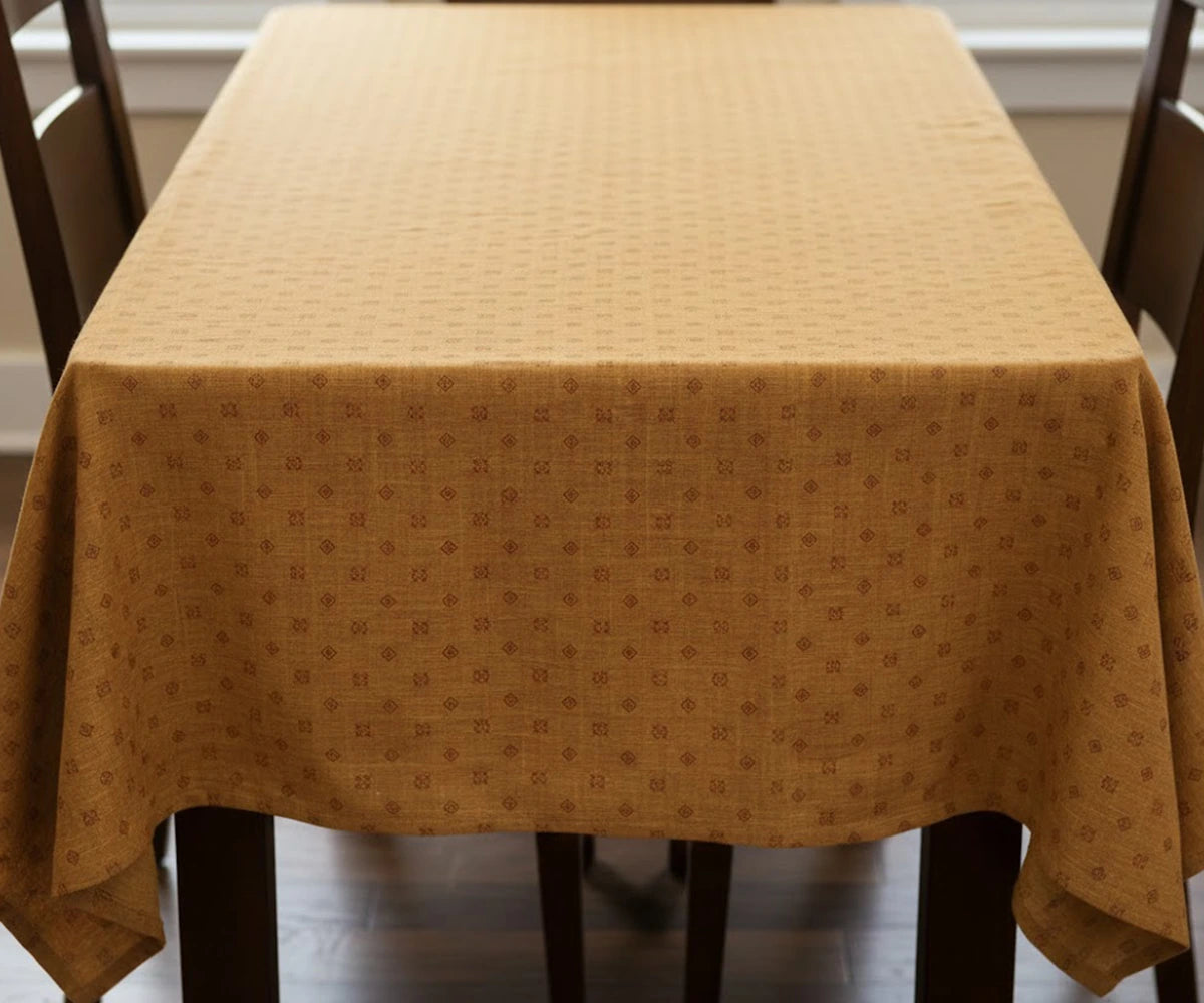 Coral printed 100% cotton tablecloth draped on rectangular dining table