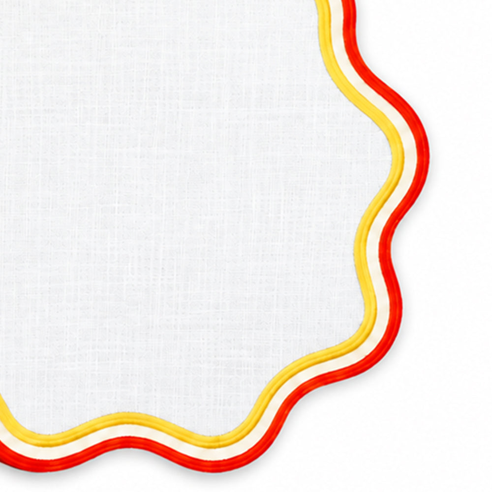 Yellow and orange round cotton table placemat with wavy scalloped border, colorful dining table décor