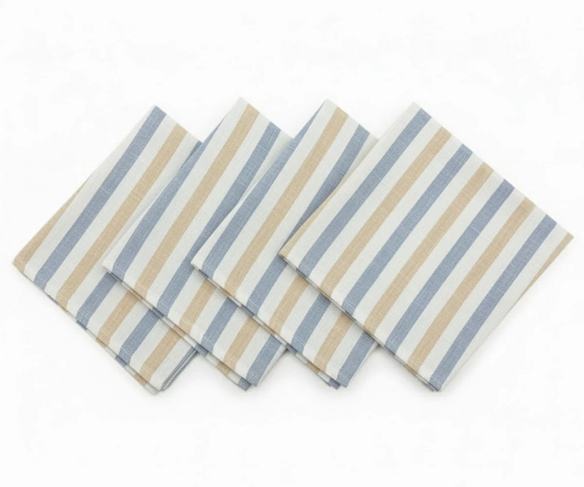Set of folded fabric napkins with blue, beige, and white horizontal stripes arranged in a fan shape on a white background