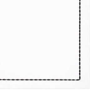 White cotton table napkins with embroidered borders in multiple colors for elegant dining