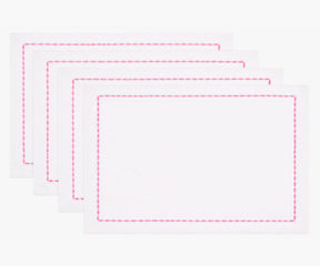 White cotton napkin with pink embroidered border