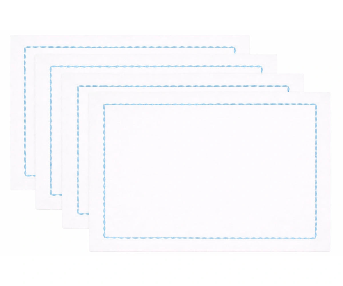 High-quality white cotton napkins with detailed embroidered borders for upscale table presentation