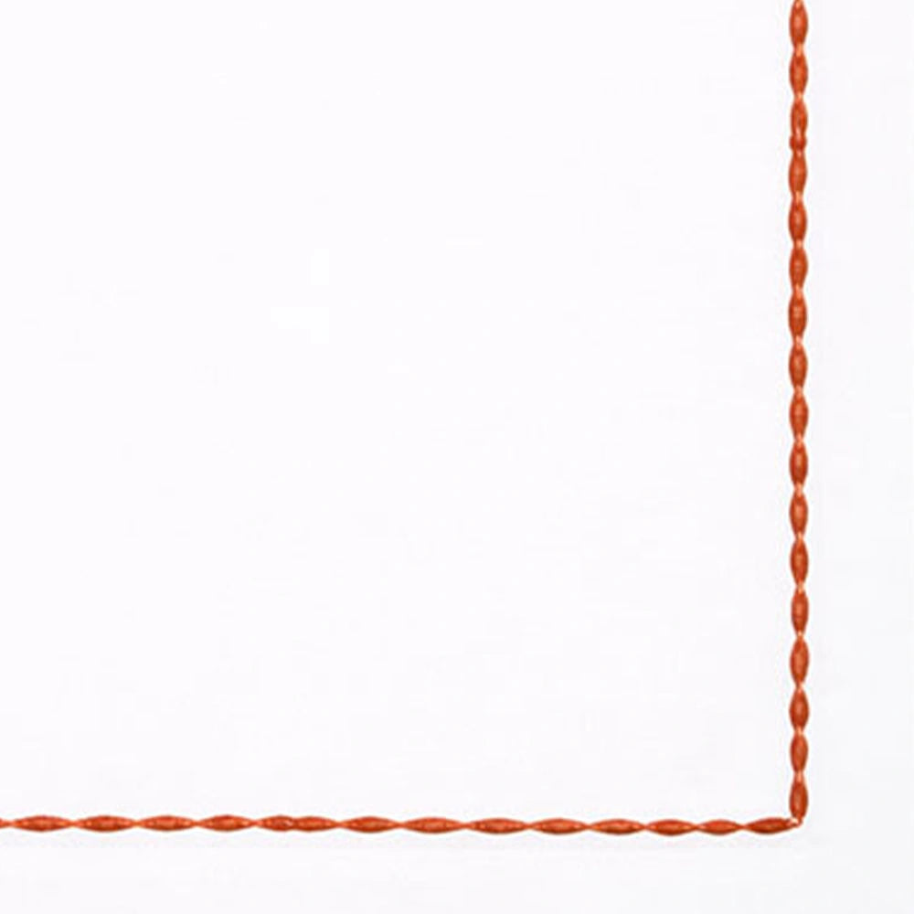 High-quality white cotton napkins with detailed embroidered borders for upscale table presentation