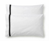 Pair of white cotton pillowcases featuring a single black embroidered accent border line.