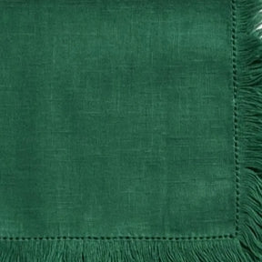 Decorative cotton cloth napkins with fringe detailing, designed for stylish table presentations and sustainable dining setups.