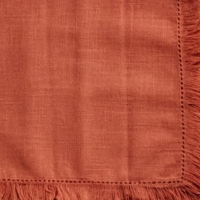 Soft fabric cotton table napkins with fringe trim, ideal for family dinners, restaurants, and event table settings.