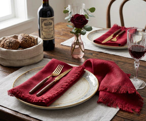 Red cotton fringe napkins with decorative frayed edges, reusable cloth dinner napkins for Christmas table settings, holiday entertaining, farmhouse dining décor, festive family gatherings, weddings, and special occasions.