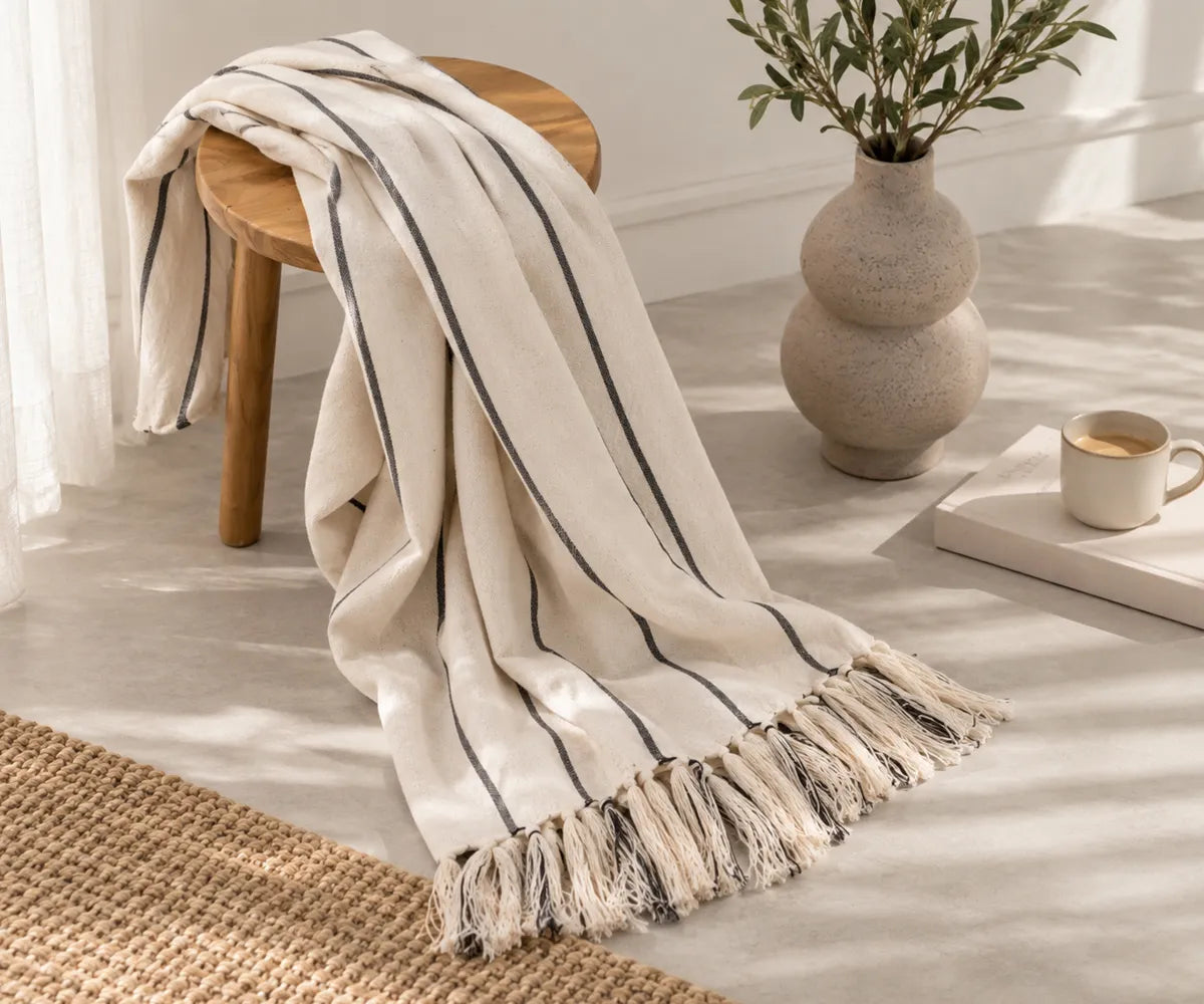 Black and white striped cotton throw blanket for holiday entertaining and winter home styling
