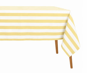 Butter yellow cabana stripe cotton linen tablecloth adding a bright, cheerful touch to a modern rectangular dining table.