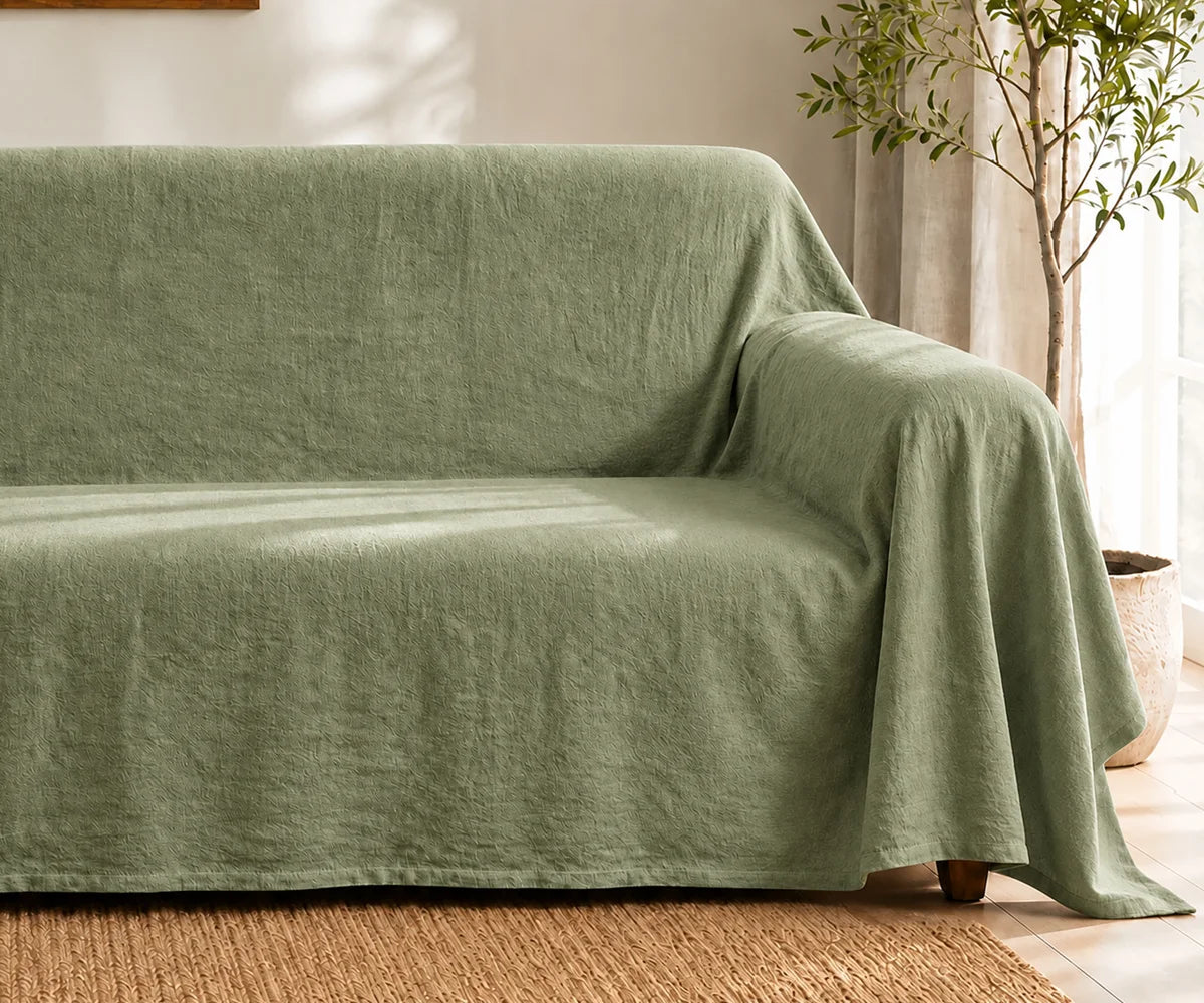 Sage green washable couch cover made from cotton linen blend fabric, reusable sofa furniture protector for modern, minimalist, and farmhouse homes
