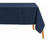 Navy blue cotton linen hemstitched tablecloth draped over a dining table