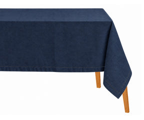 Navy blue cotton linen hemstitched tablecloth draped over a dining table