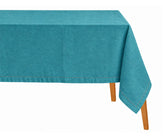Teal cotton linen tablecloth with hemstitch detailing draped on a wooden table.   