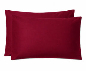 Two deep burgundy pillowcases stacked together on a plain white background.