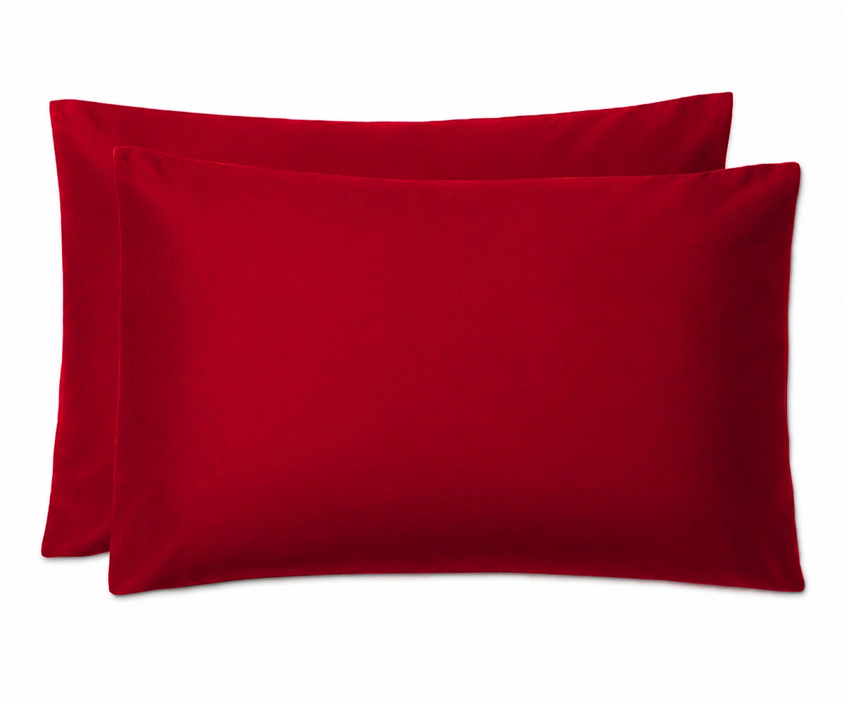 Two cherry red pillowcases stacked together on a clean white background.