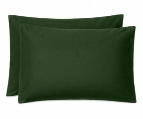 Two dark forest green pillowcases stacked together on a plain white background.