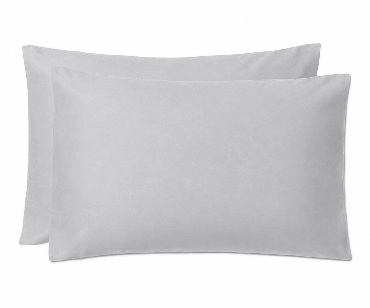 Two plain grey rectangular pillowcases stacked slightly offset against a white background.