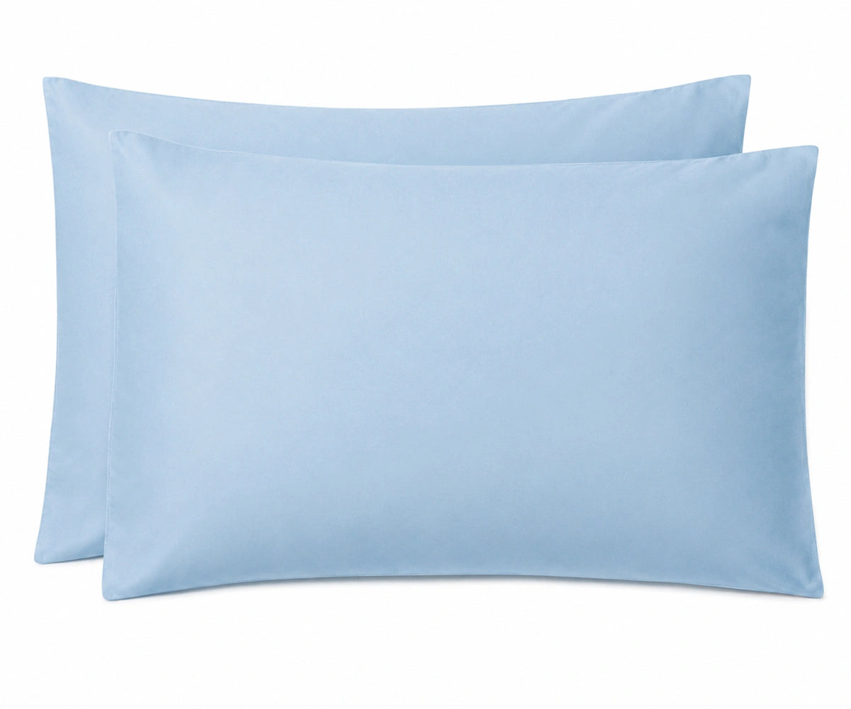 Two light blue pillowcases stacked together on a plain white background.