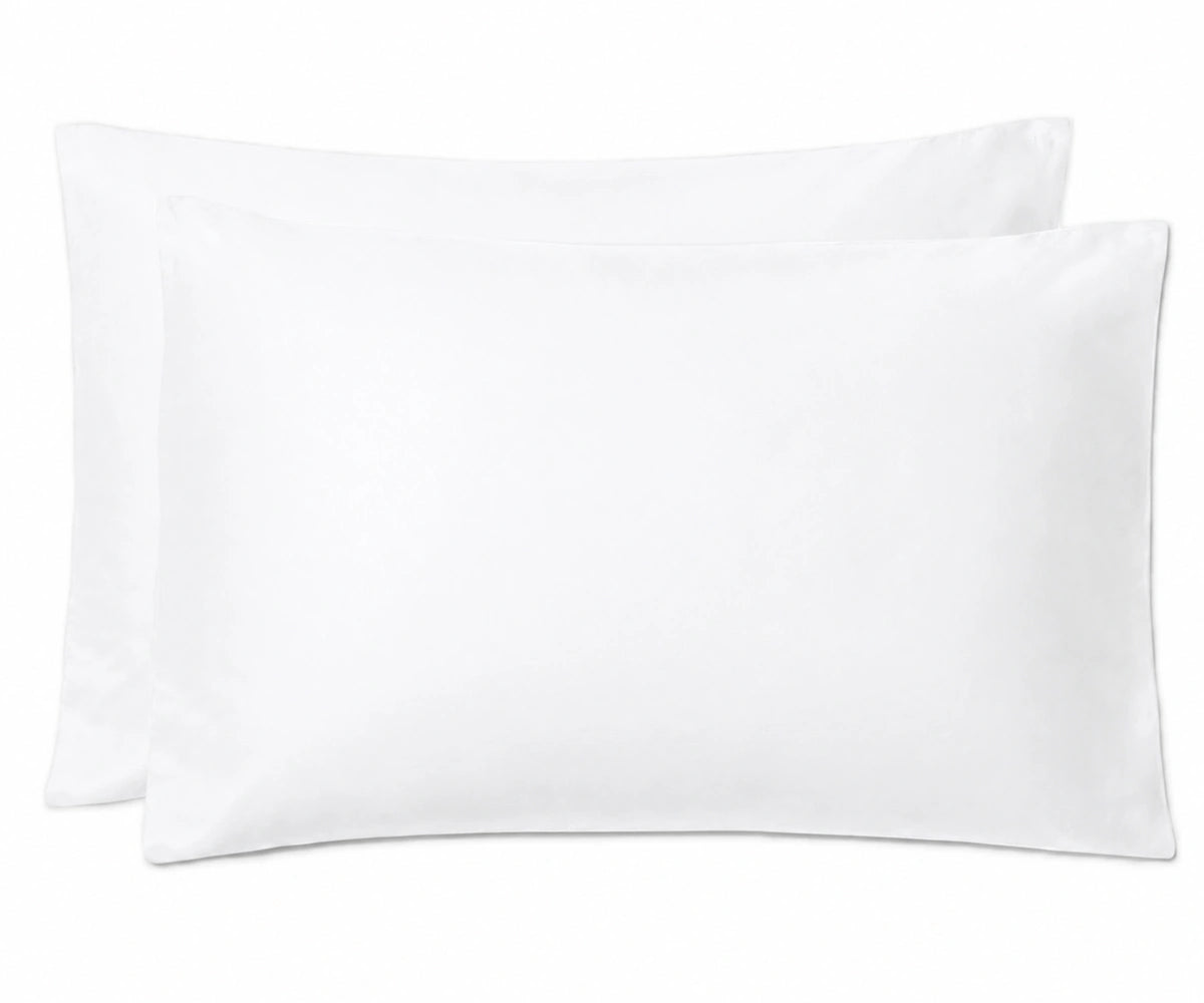 Two plain white rectangular pillows stacked slightly offset against a white background.