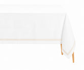 Ivory satin tablecloth with white cotton base and elegant border, styled for a refined rectangular dining table, weddings, formal dinners, and holiday gatherings.