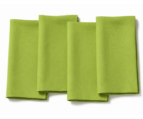 A set of four plain apple green fabric dinner napkins, neatly folded and displayed side-by-side against a clean white background.