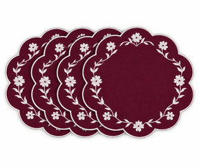 Burgundy scalloped placemats with white floral embroidered border design