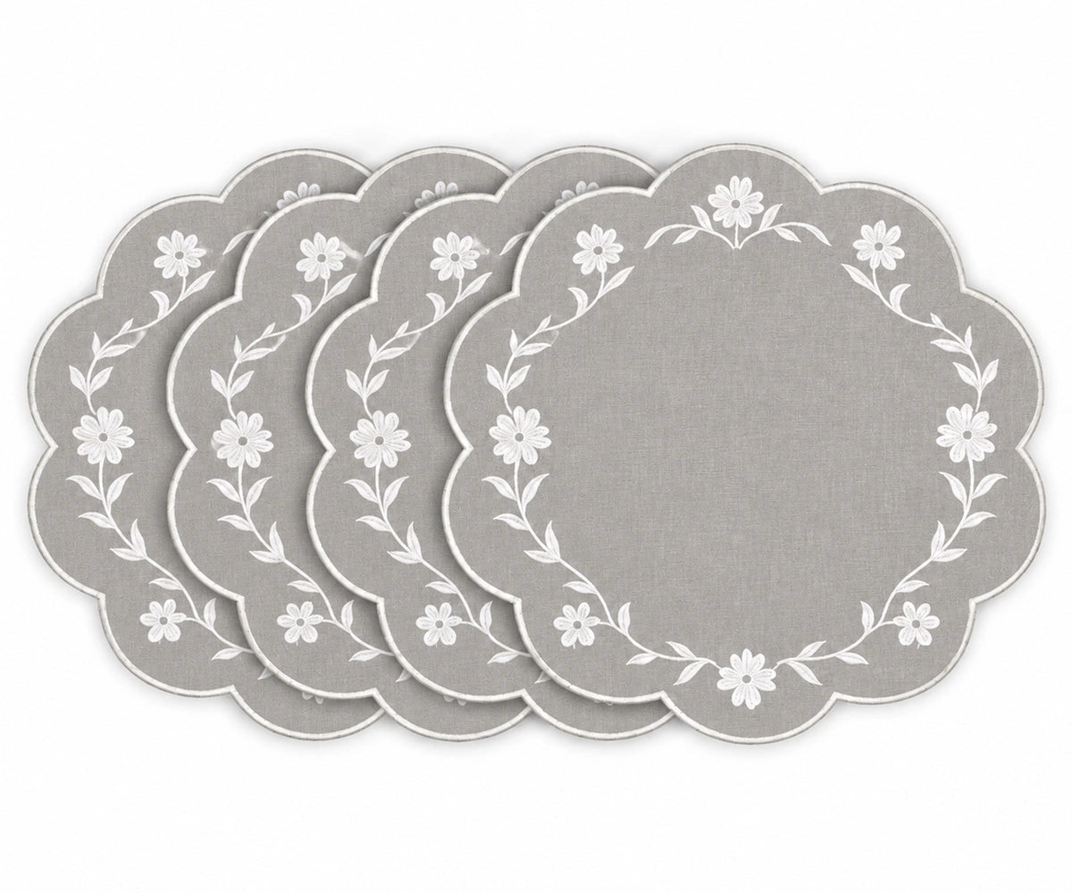 light grey scalloped placemats with white floral embroidered border design
