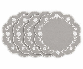 light grey scalloped placemats with white floral embroidered border design