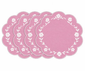pink scalloped placemats with white floral embroidered border design
