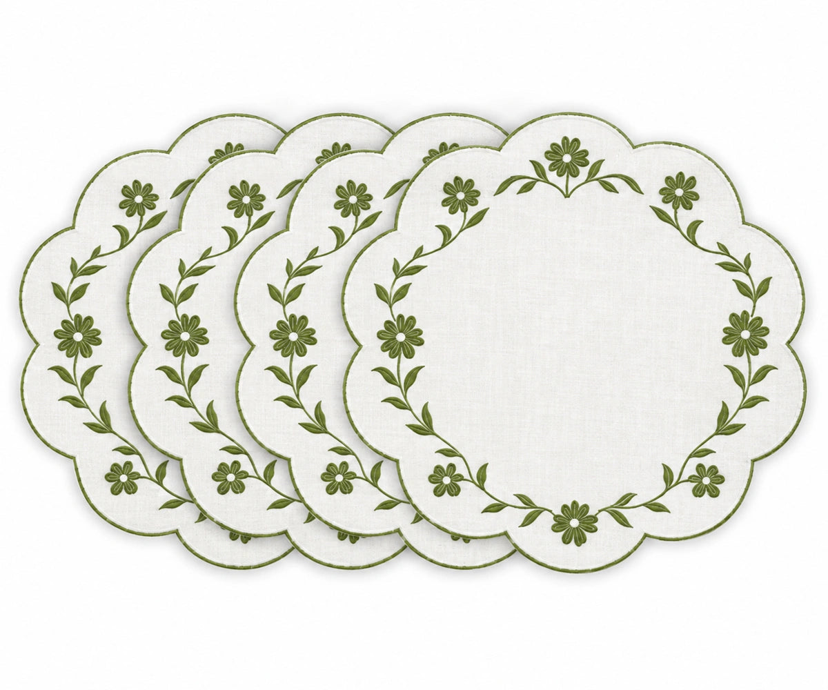 white scalloped placemats with white floral embroidered border design