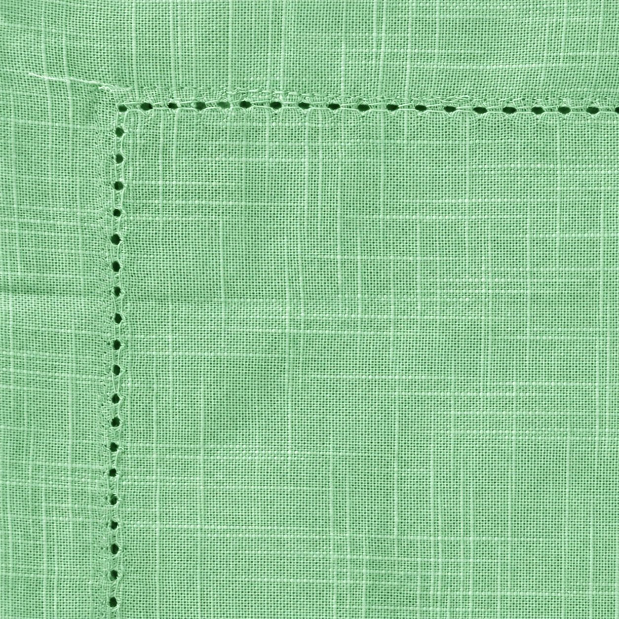 Close-up of sage green cotton hemp napkin showing hemstitch border detailing and textured weave.