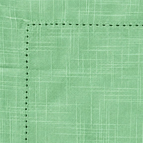 Close-up of sage green cotton hemp napkin showing hemstitch border detailing and textured weave.