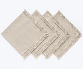 Shop natural cotton napkins with woven fabric and fringe trim. Ideal for farmhouse dining, holiday tables, dinner parties, and elegant place settings.