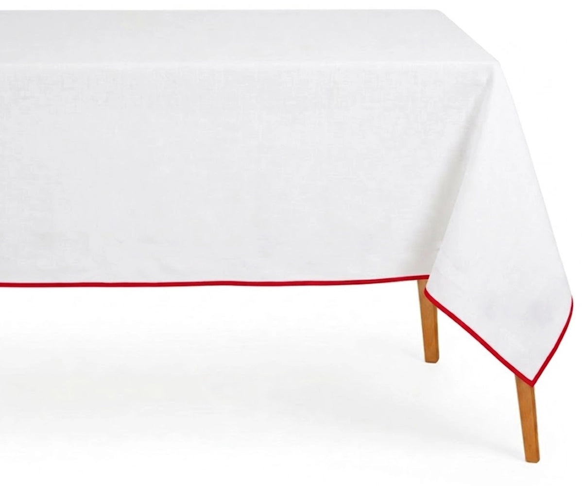 White Cotton  table Cloth with red border for a dinner.