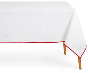 White Cotton  table Cloth with red border for a dinner.