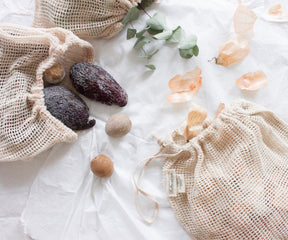 Eco-friendly mesh bag with a fresh assortment of eggs and produce