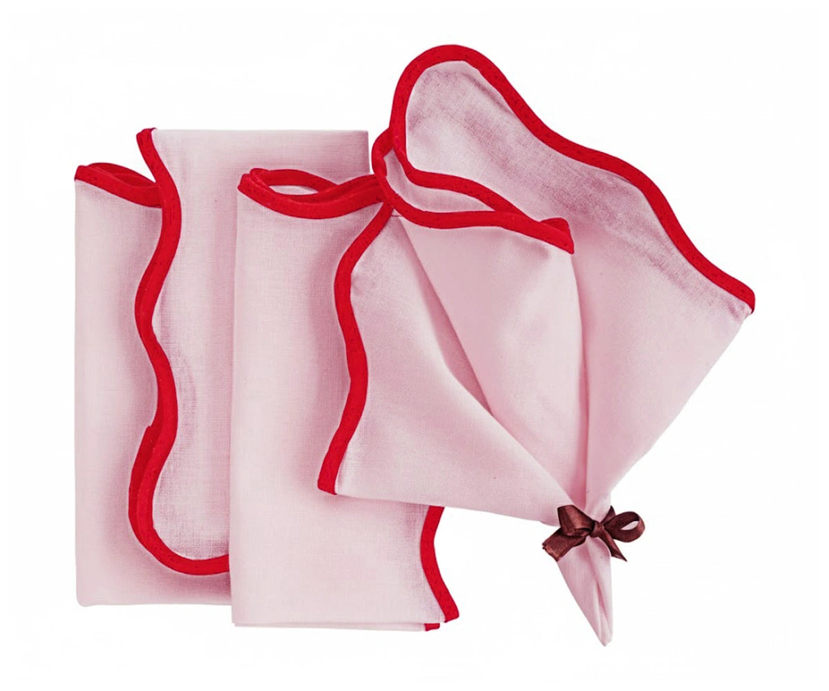 Soft pink fabric napkin featuring red scalloped edges – decorative embroidered napkin