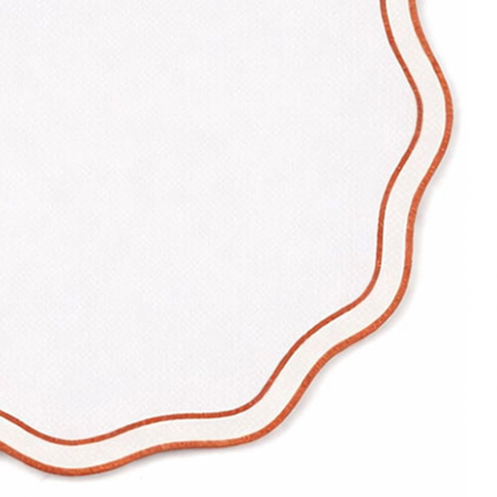 Terracotta and white embroidered round placemats styled on farmhouse dining table, cotton placemats with scalloped edges for modern décor