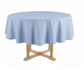 Round table with a light blue tablecloth 