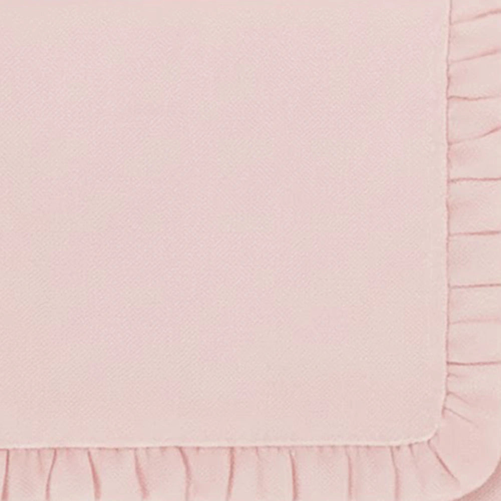 Light pink fabric napkins with ruffle edge