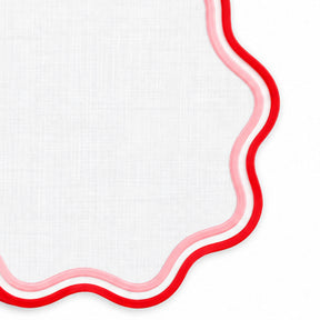 Pink and red round cotton placemat with scalloped wavy trim, colorful dining table mat