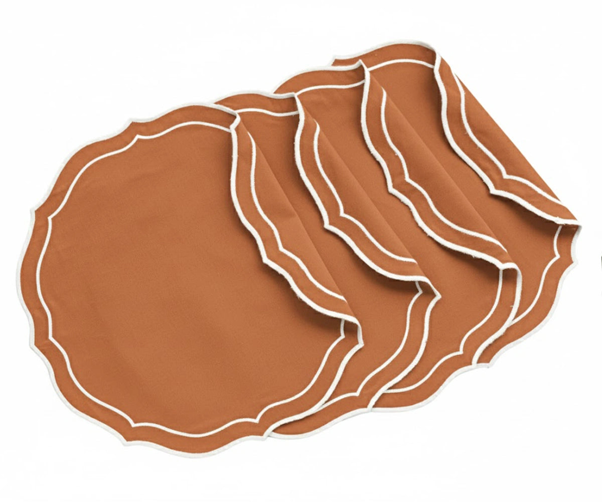 Round terracotta embroidered placemats set of 4 made from 100% cotton, featuring elegant scalloped edges.