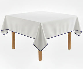 White dining tablecloth with Navy blue piping trim