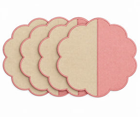 Cotton scalloped round placemat set in beige and pink.