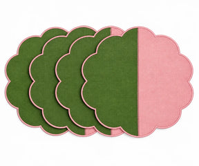 Cotton scalloped round placemat set in green and pink.