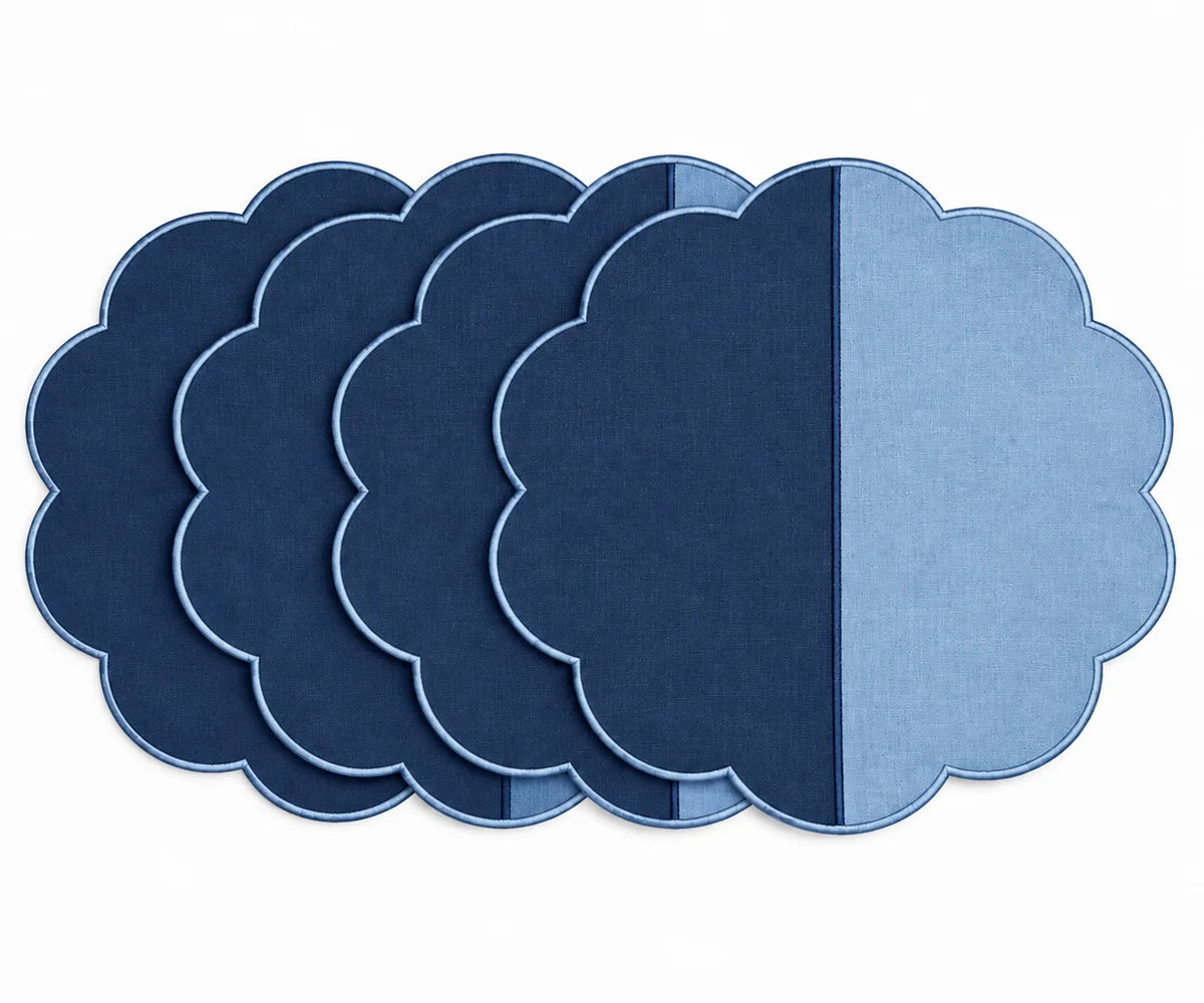 Cotton scalloped round placemat set in light blue and navy.   