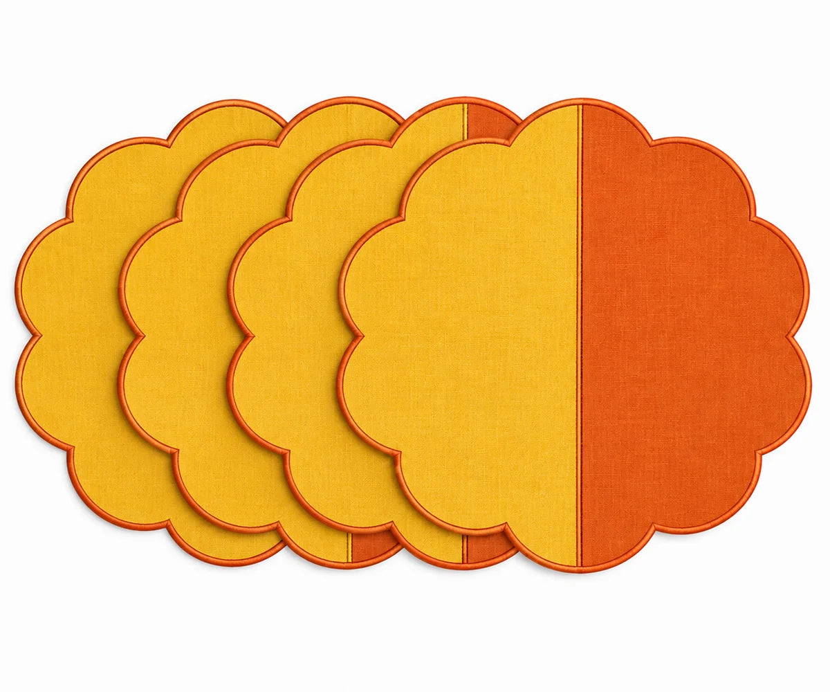 Cotton scalloped round placemat set in yellow and orange.